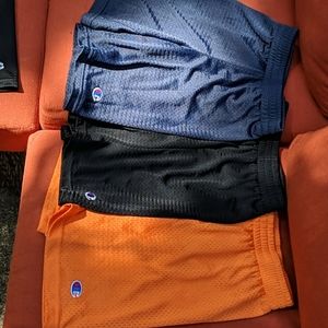 Three pairs of boys shorts orange, navy, black
